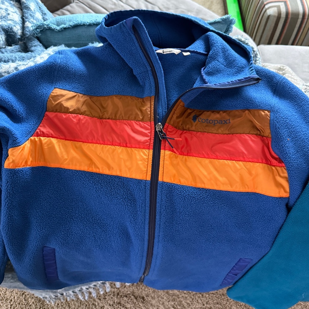 Cotopaxi Fleece Hooded Jacket Blue with Red and Orange Stripes